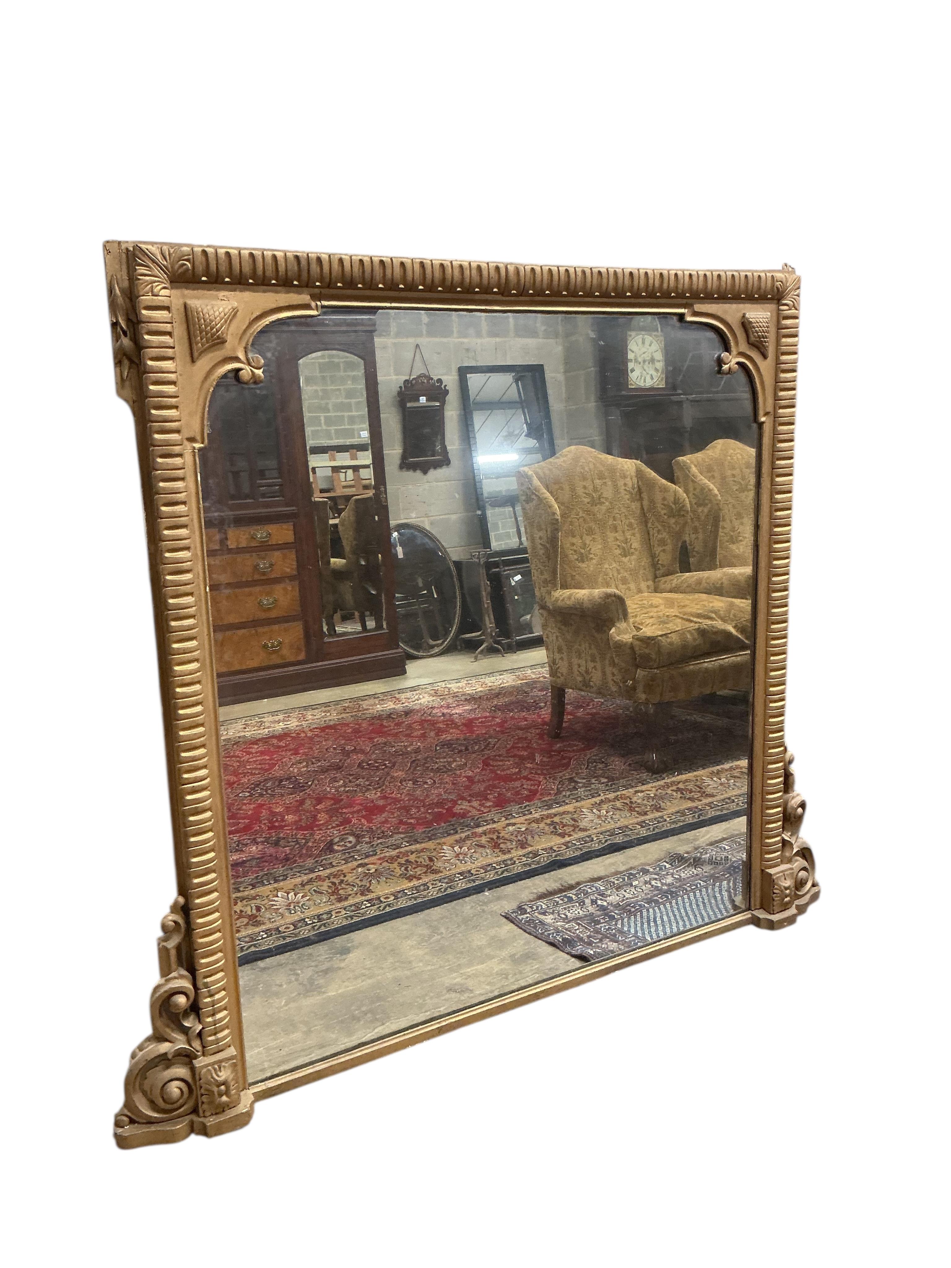 A large Victorian giltwood and composition overmantel mirror, width 170cm, height 150cm